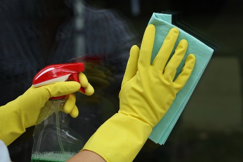 Professional cleaner in Edgware cleaning a modern living room